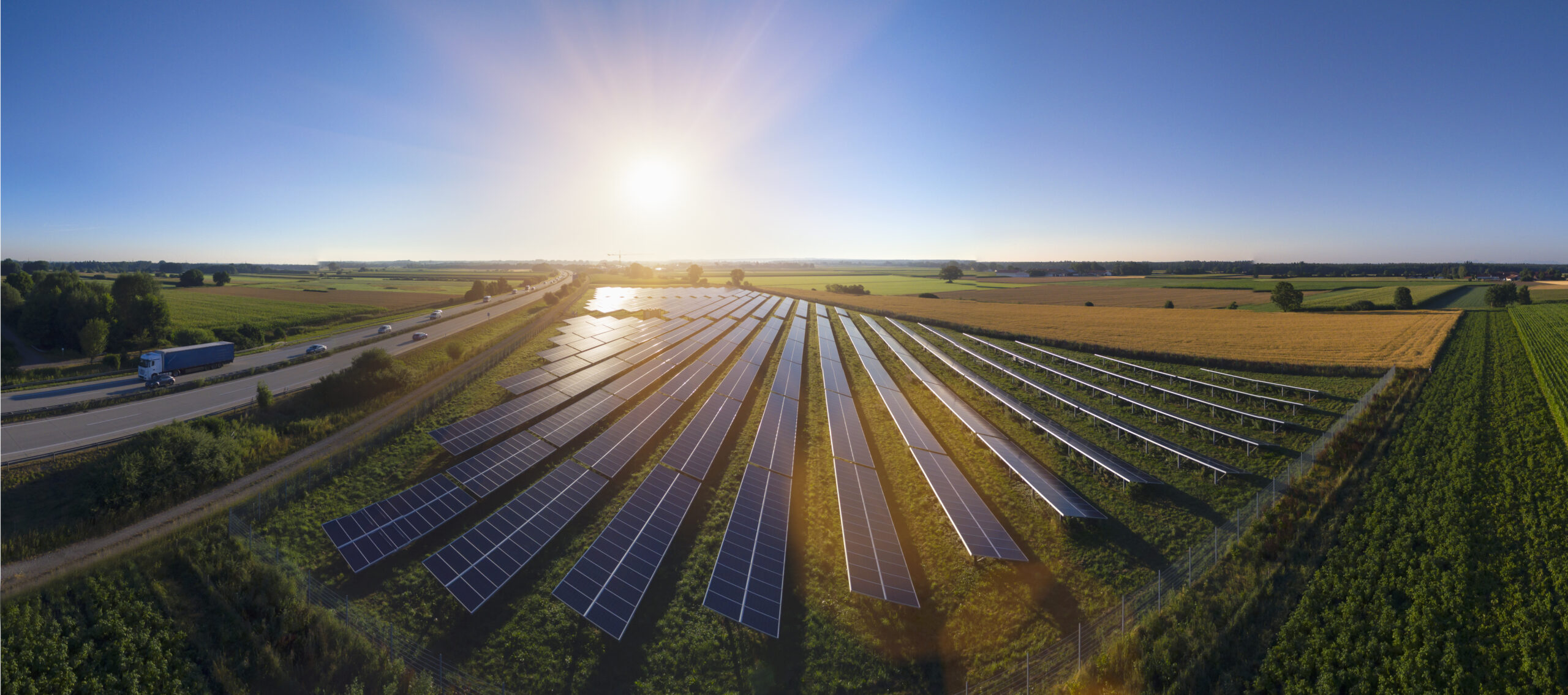 Elevated panoramic landscape with rows of solar panels, Bavaria, Germany