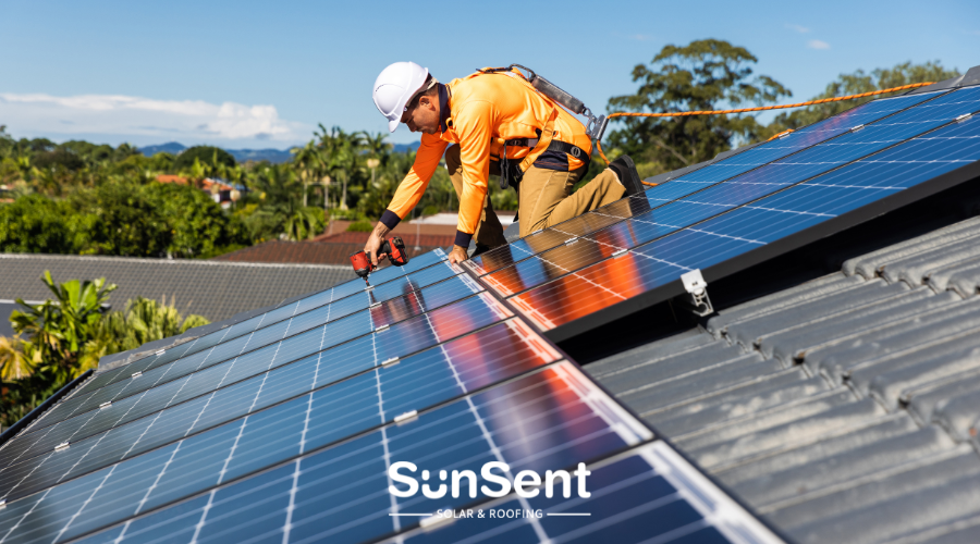 Solar panel installation technician securing panels on a home’s roof, demonstrating SunSent’s professional installation process.